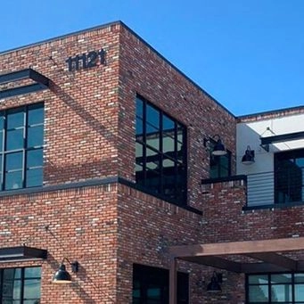 Aviara center brick building exterior in Los Alamitos.