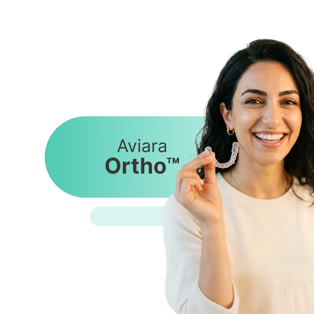 Model teeth with colorful braces; orthodontic treatment