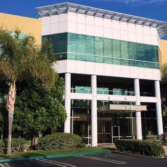Aviara center building exterior in San Clemente with modern glass facade.