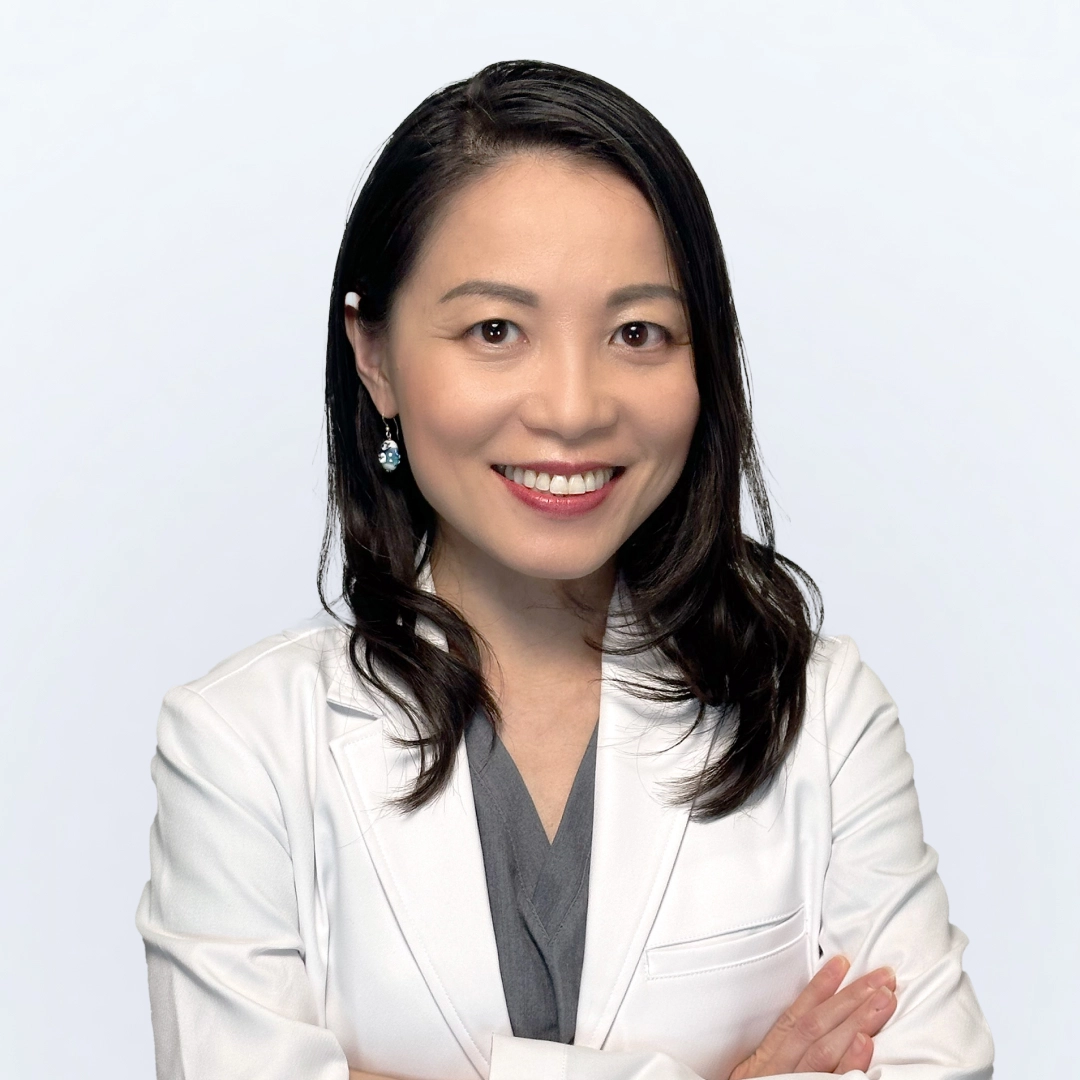 Professional photograph of Dr. Rita Chuang in lab coat in studio